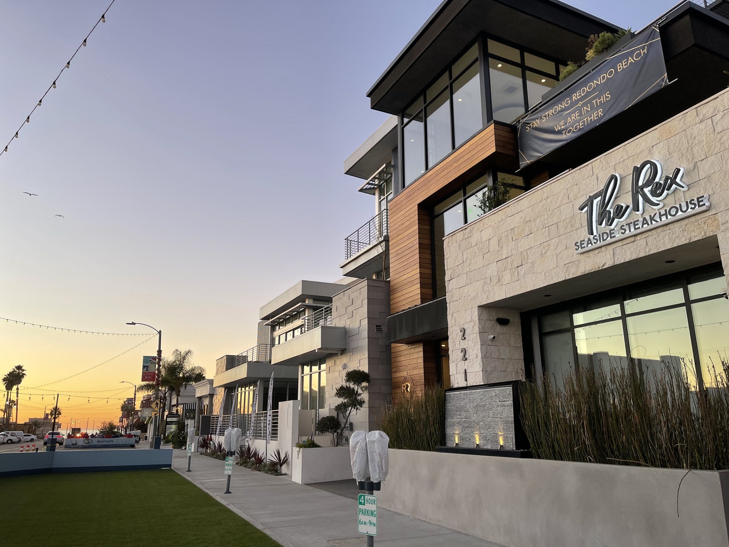 The Rex Seaside Steakhouse exterior at sunset in Redondo Beach
