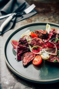 Grilled wagyu carpaccio with heirloom tomatoes