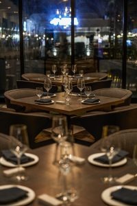 Private dining room with glass walls and city views