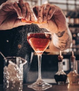 Craft cocktail preparation at The Rex bar