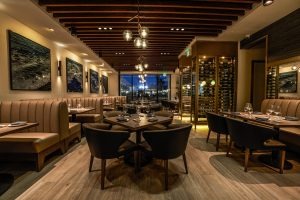 The Rex main dining room with wine cellar and banquette seating